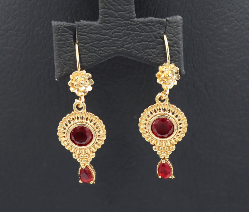 Women's Red stone studded gold coloured dangle earring.
