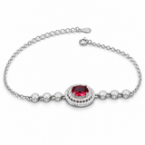 925 sterling silver bracelet with oval red centerpiece and halo setting on a white background