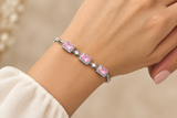 925 sterling silver bracelet with three pink rectangular stones worn on a hand