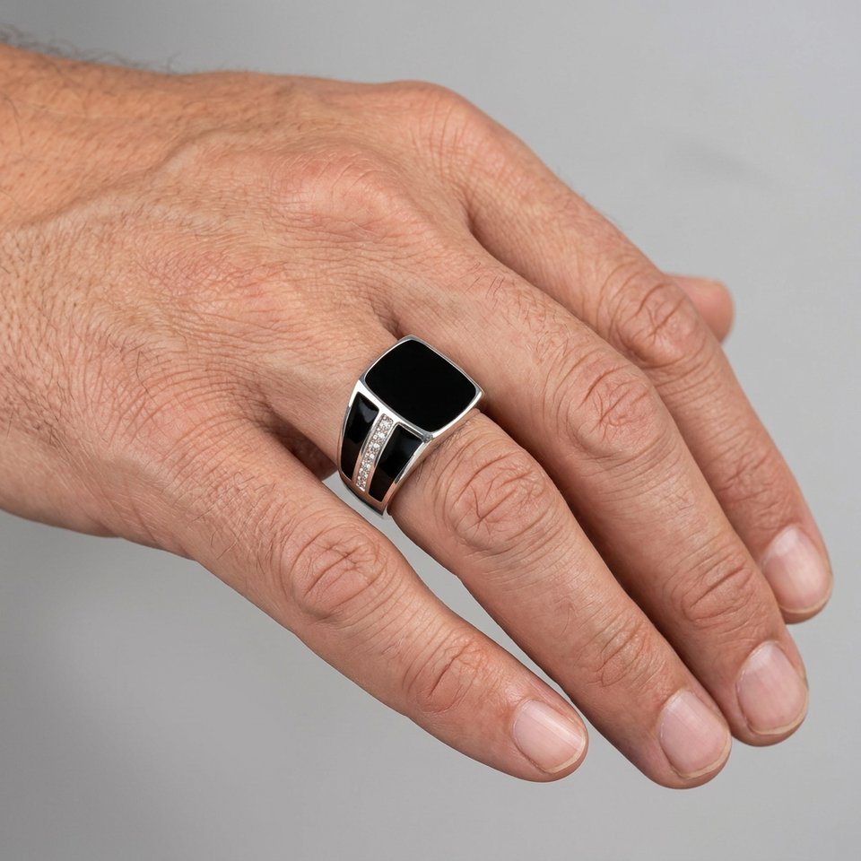 Hand wearing the black rectangular signet ring