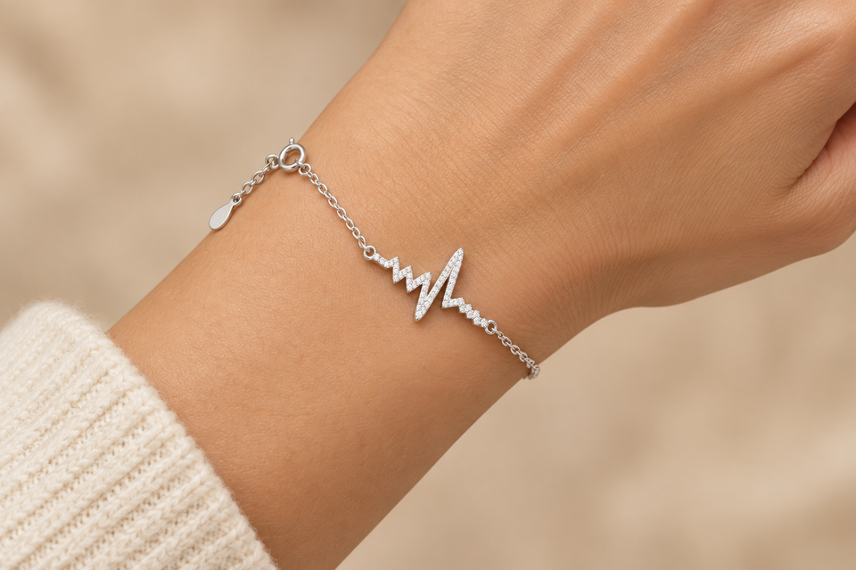 925 sterling silver heartbeat bracelet with ECG waveform centerpiece worn on a hand