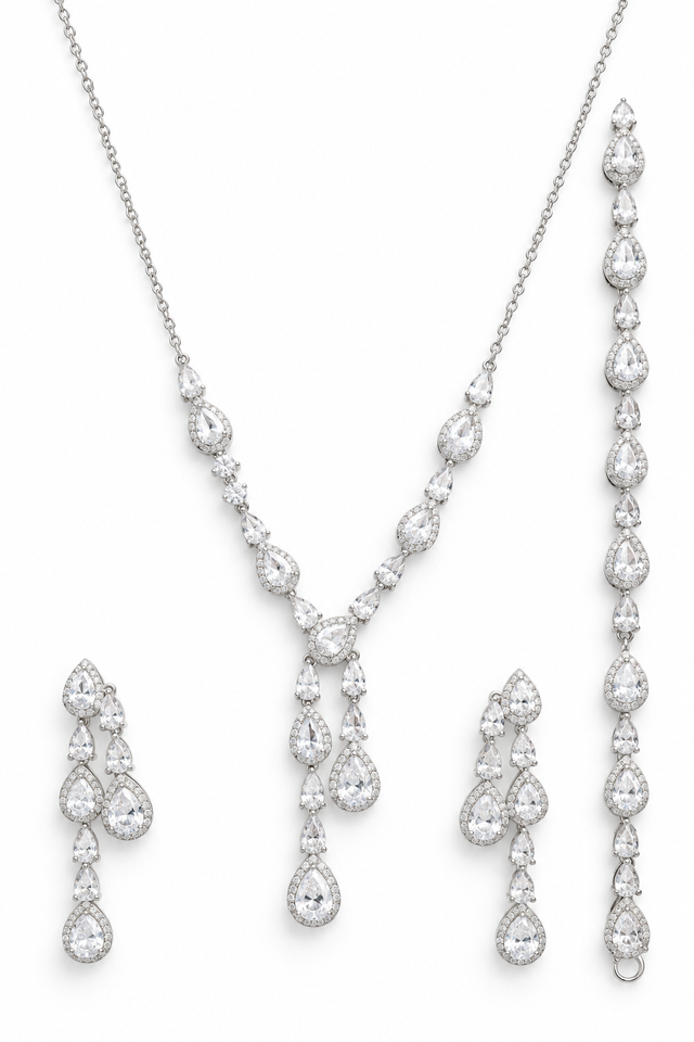 925 sterling silver teardrop jewelry set with necklace, bracelet, and drop earrings on a white background