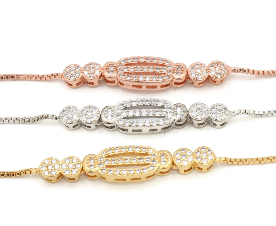 zirconia studded gold, pink gold and rhodium plated slider bracelet