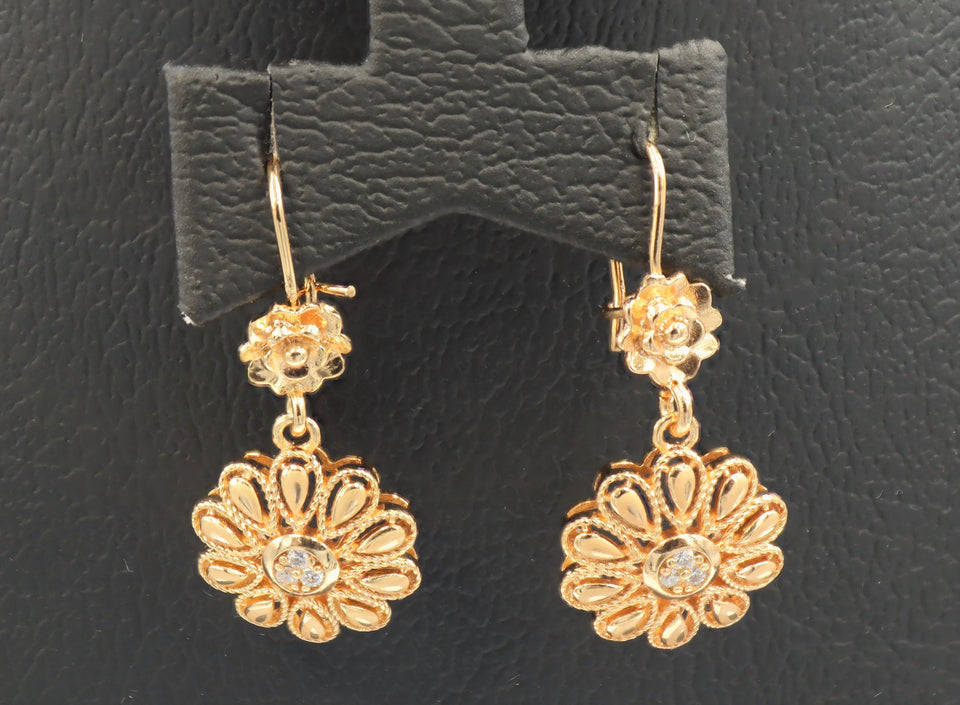 Women's Floral design dangling earring studded with zircon stones.